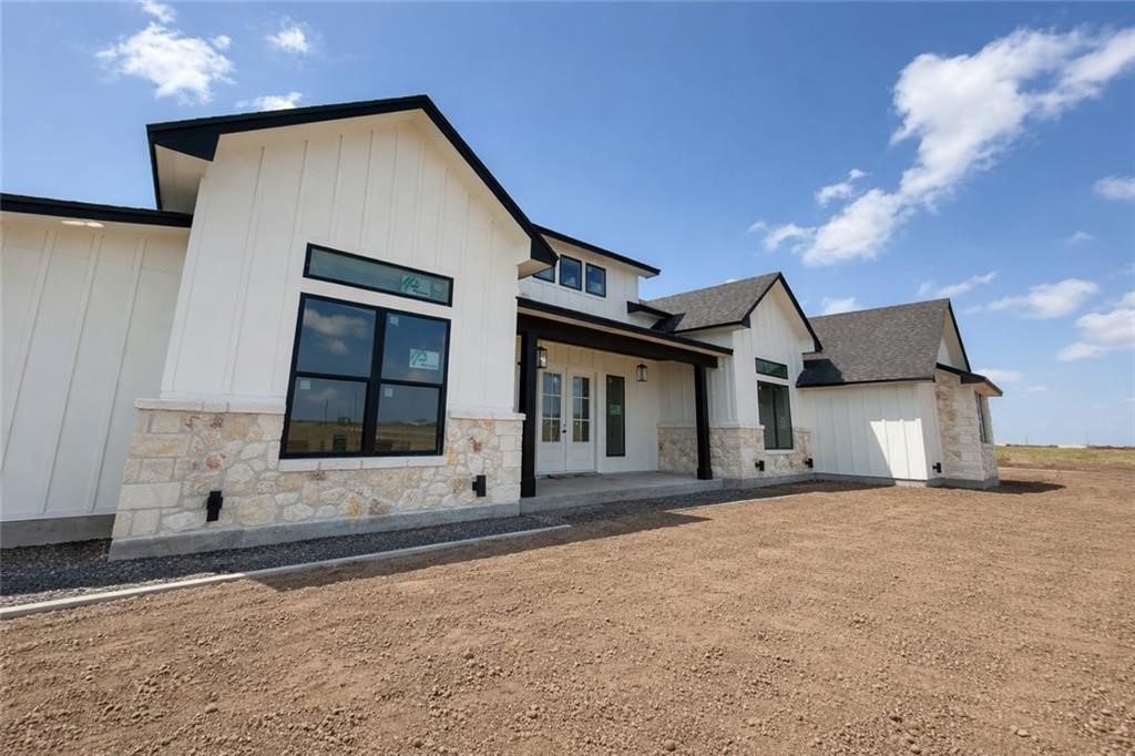 2193 London Ranch Drive Corpus Christi, TX 78415 - Photo 1 of 6 a front view of a house with a yard and garage
