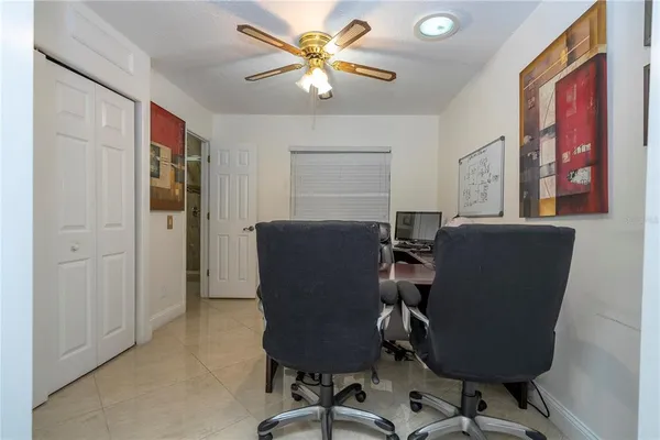 a large kitchen with a table and chairs