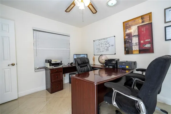 a kitchen with stainless steel appliances kitchen island granite countertop a refrigerator and a sink