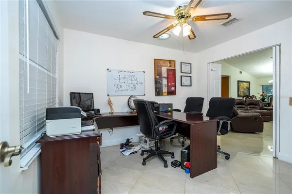 a kitchen with stainless steel appliances kitchen island granite countertop a refrigerator and a sink