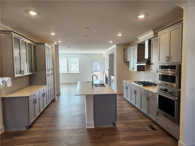 a kitchen with a sink and cabinets
