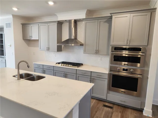 a bathroom with a tub a sink and a window