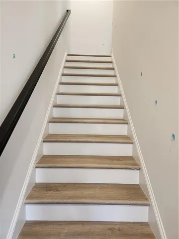 a bathroom with a toilet and a bath tub