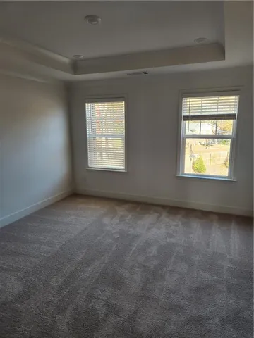 a bathroom with a shower sink and mirror