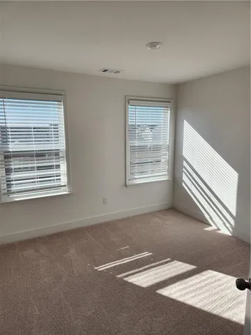 a view of a swimming pool with outdoor seating