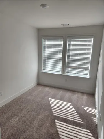 a view of a patio with dining table and chairs with wooden floor