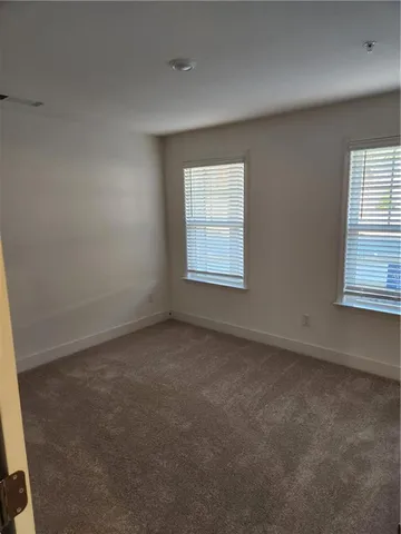 a bathroom with a shower and a toilet