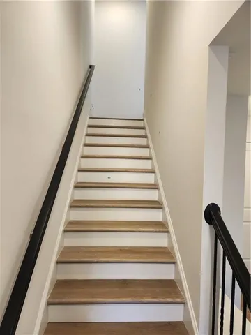 a kitchen with granite countertop a sink a stove and cabinets