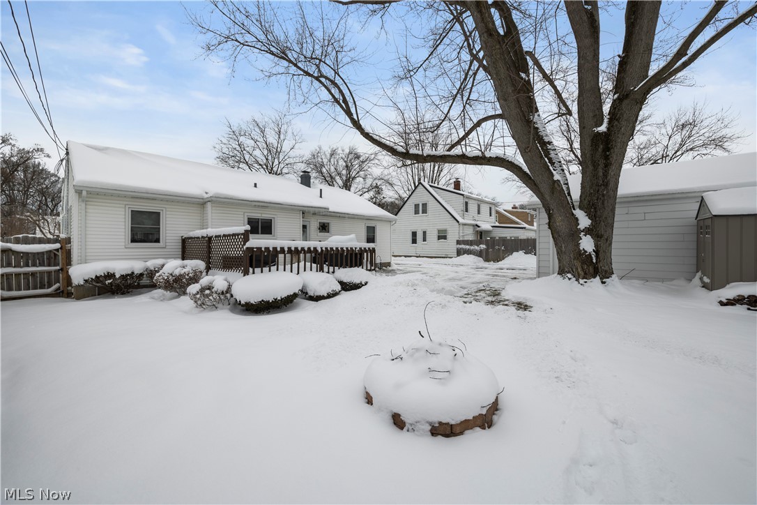 965 Gulf Road Elyria, OH 44035 - Photo 36 of 37 Snow covered property showing garage, shed, fire pit area