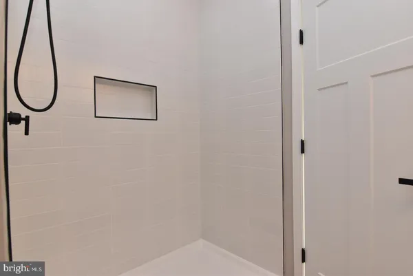 a picture of a bathroom with a mirror