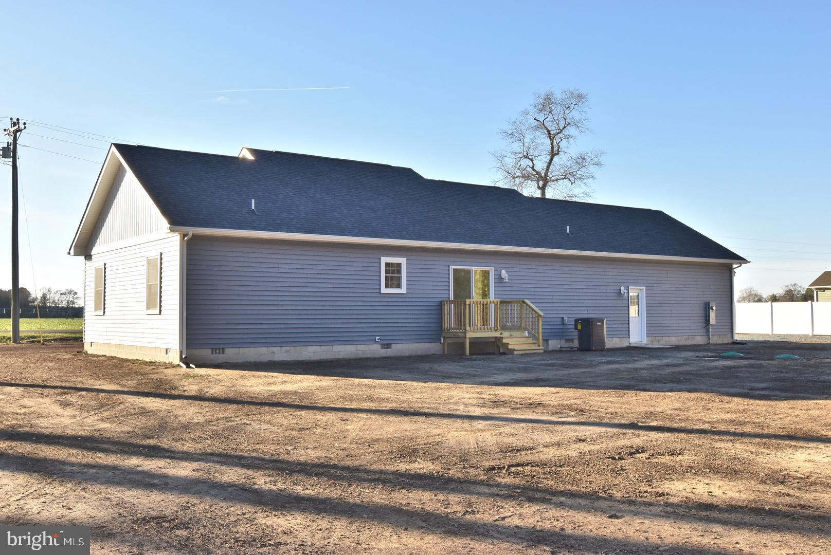 34327 Branch School Road Laurel, DE 19956 - Photo 20 of 23 a view of a house with a patio