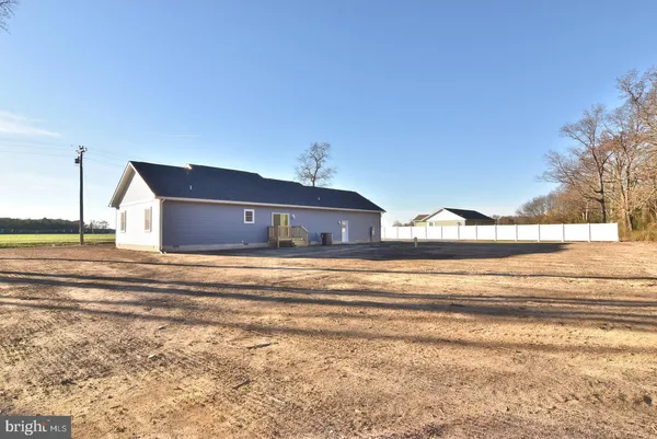 a view of an empty room with stairs