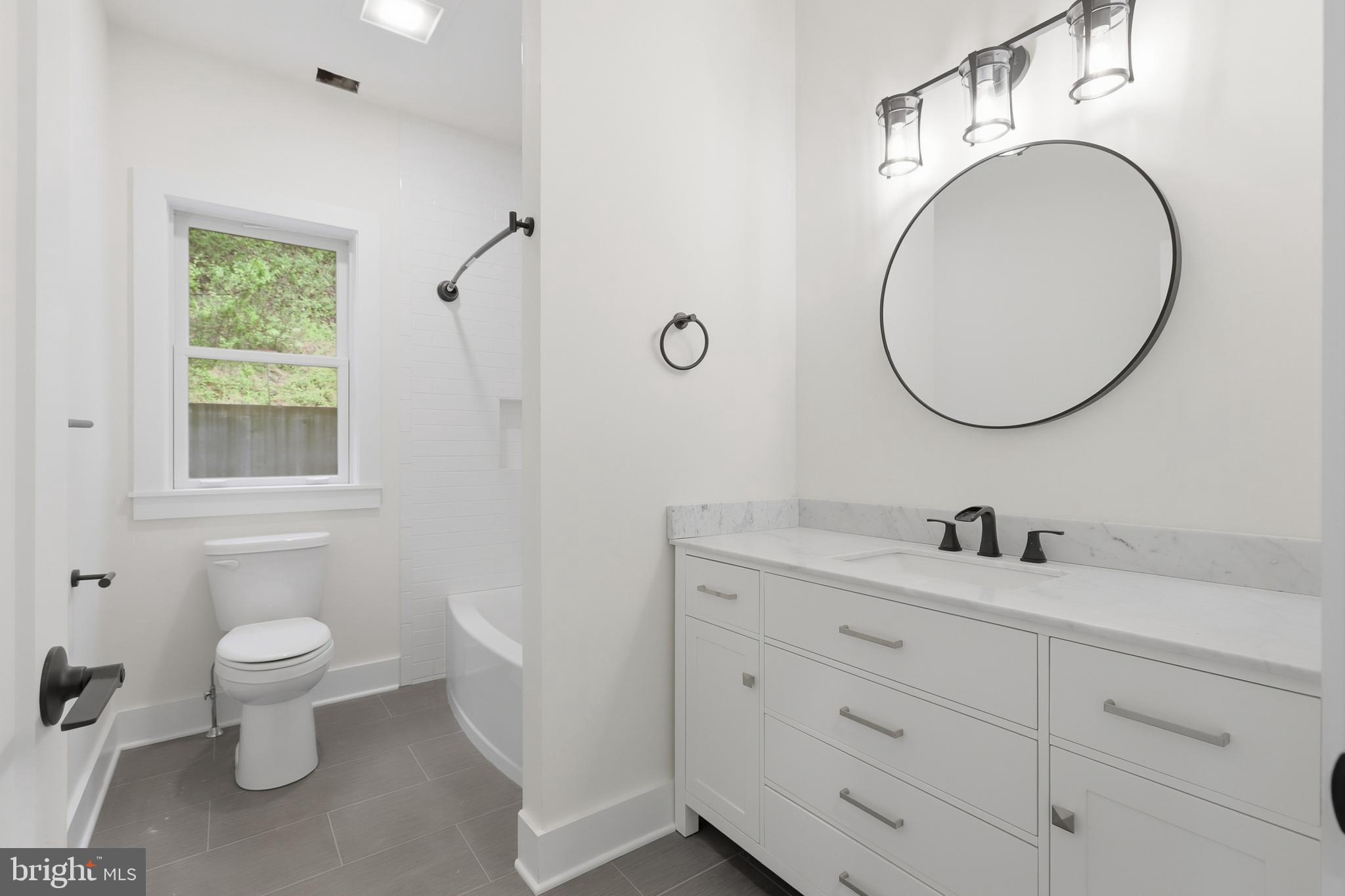 759 River Road Erwinna, PA 18920 - Photo 22 of 46 a bathroom with a toilet sink and mirror