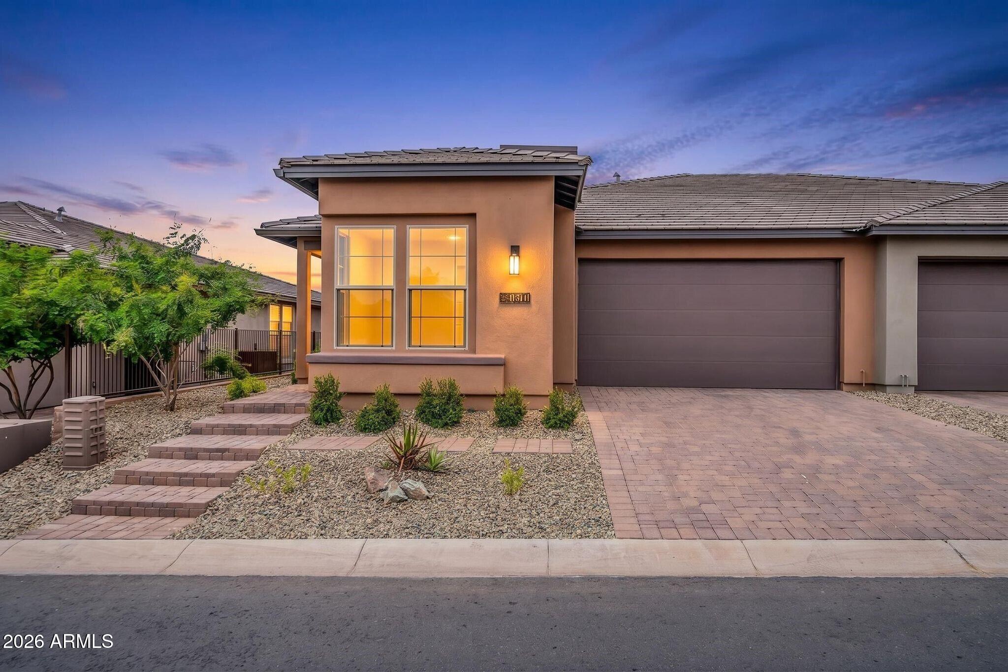 18221 East Spring Valley Court Rio Verde, AZ 85263 - Photo 1 of 49 a front view of a house
