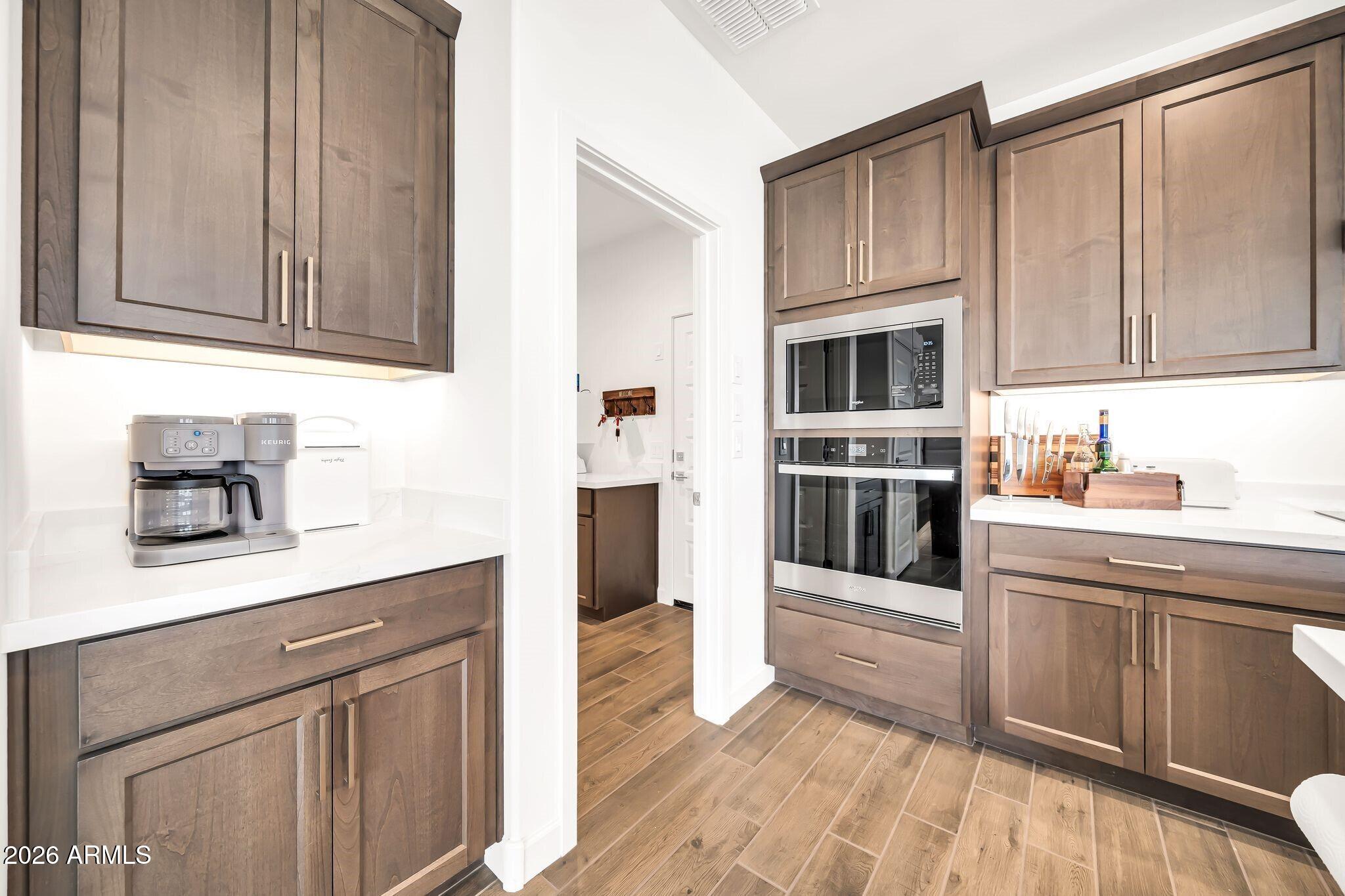 18221 East Spring Valley Court Rio Verde, AZ 85263 - Photo 13 of 49 a kitchen with stainless steel appliances a stove and cabinets
