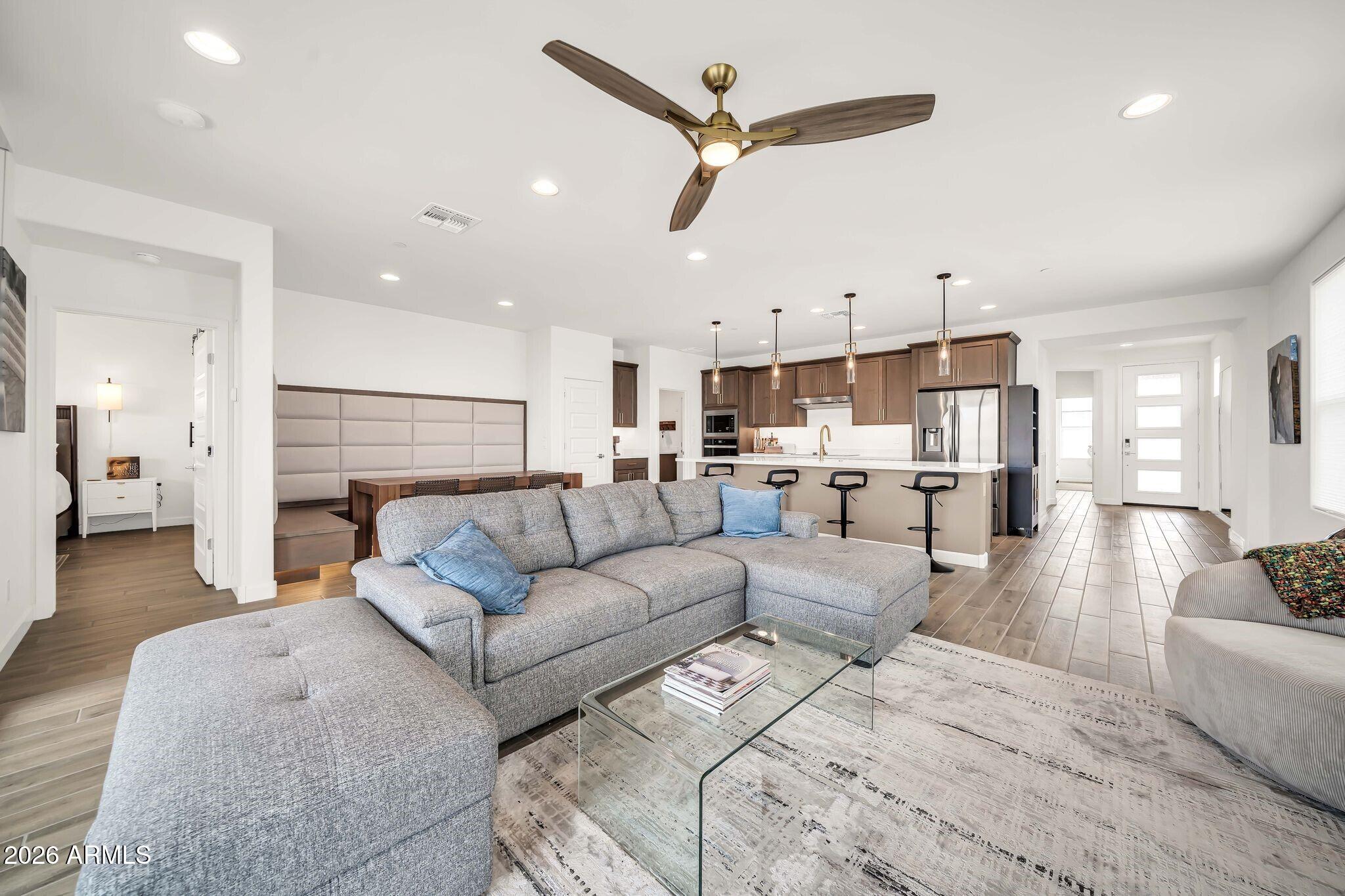 18221 East Spring Valley Court Rio Verde, AZ 85263 - Photo 48 of 49 a living room with furniture kitchen view and a ceiling fan