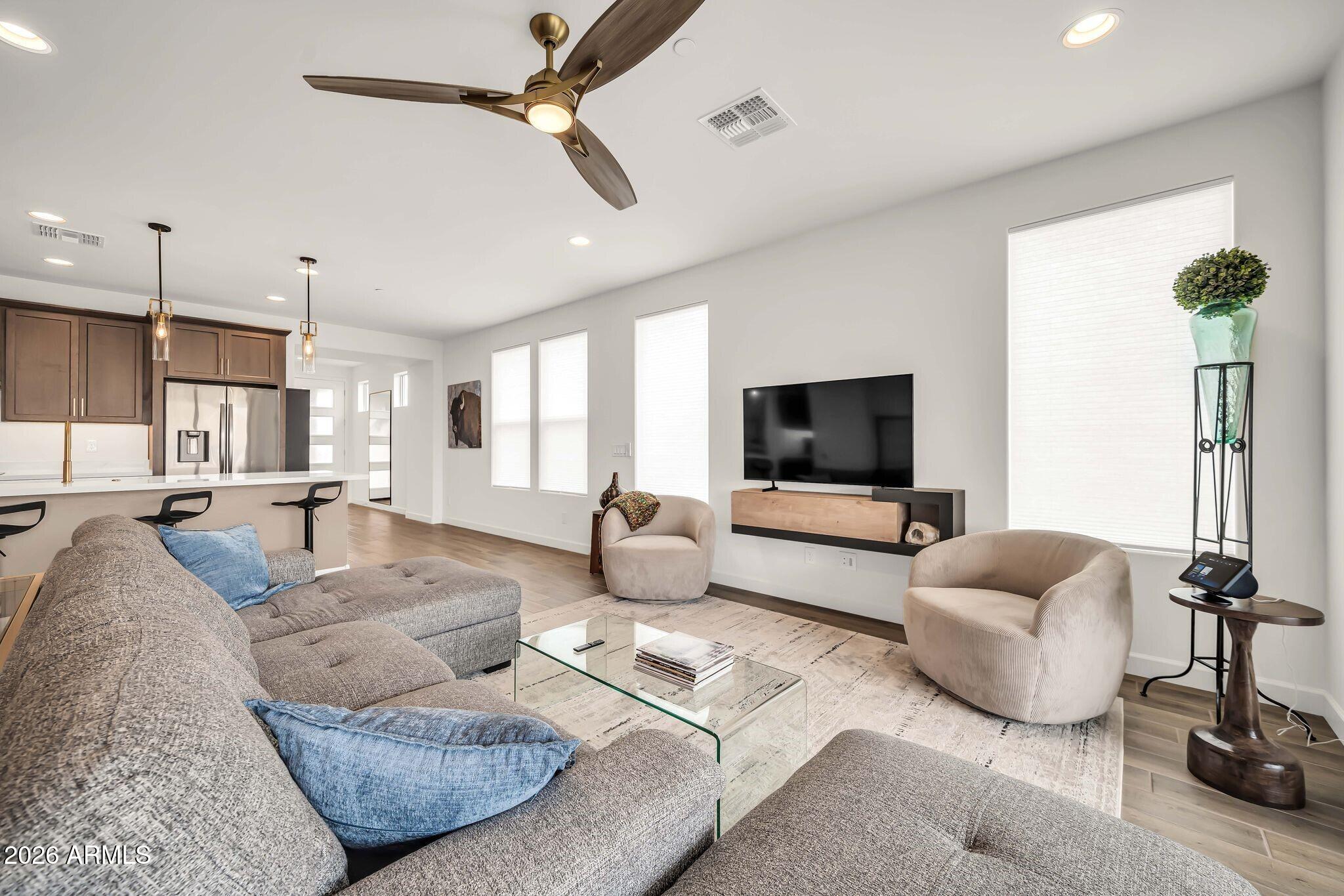 18221 East Spring Valley Court Rio Verde, AZ 85263 - Photo 15 of 49 a living room with furniture and a flat screen tv