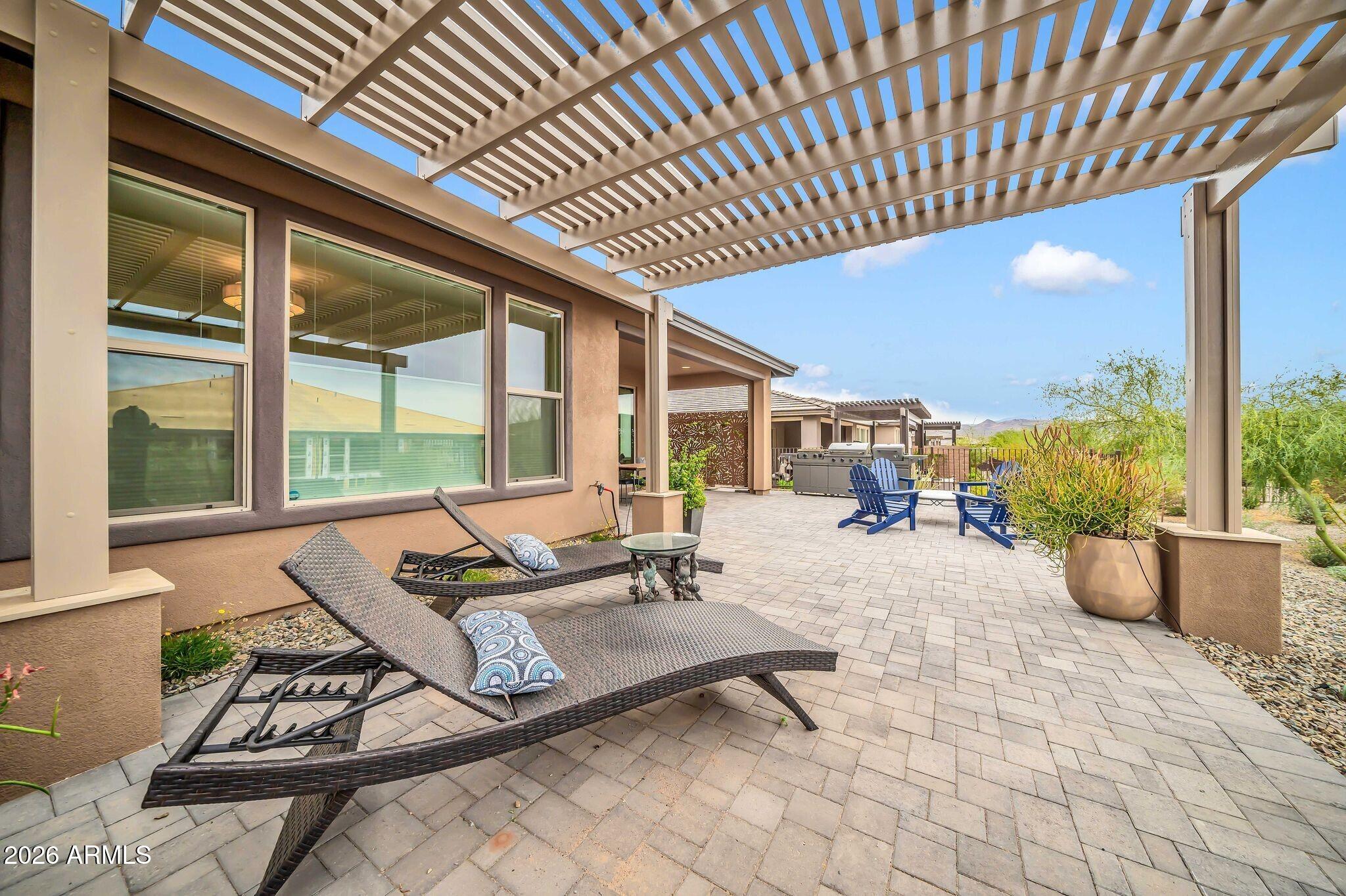 18221 East Spring Valley Court Rio Verde, AZ 85263 - Photo 30 of 49 a building outdoor space with patio furniture and potted plants