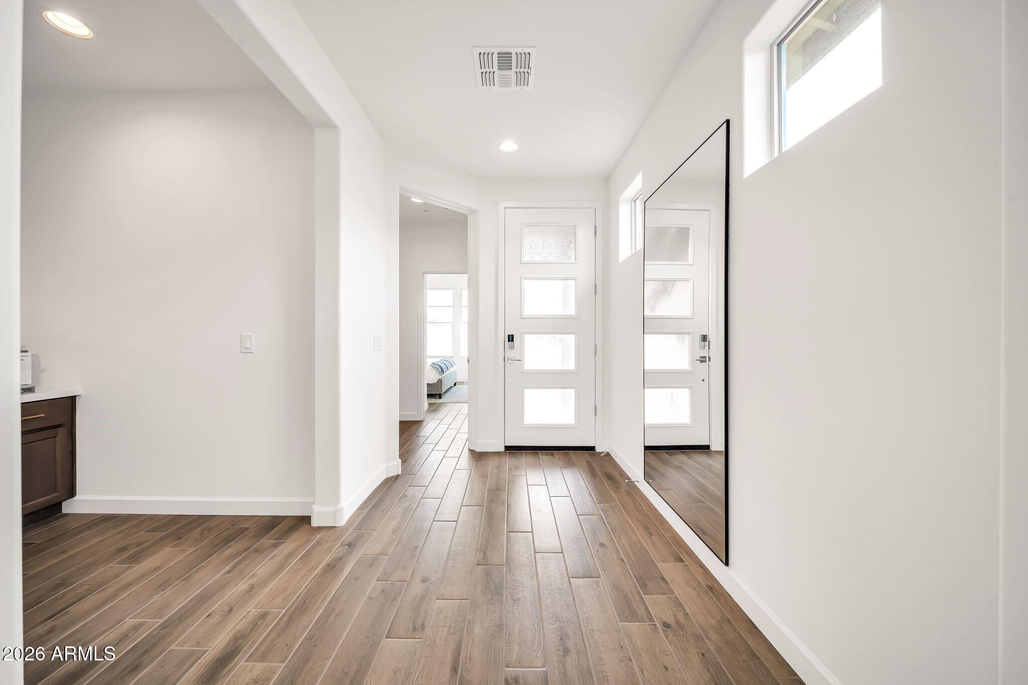 18221 East Spring Valley Court Rio Verde, AZ 85263 - Photo 7 of 49 a view of a hallway with wooden floor