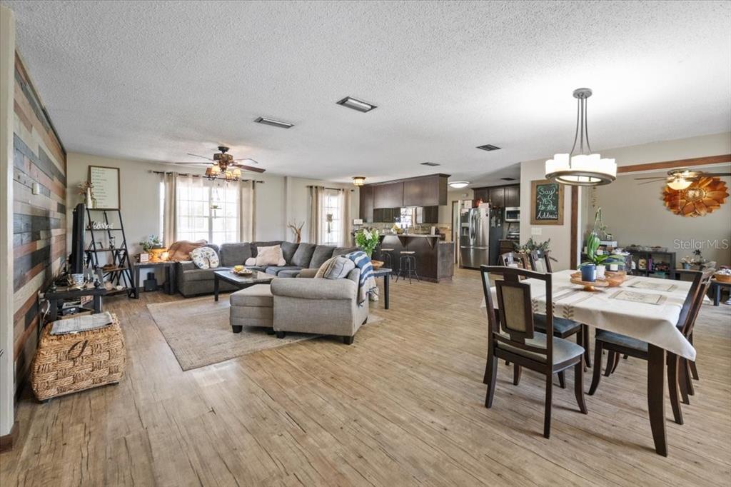 7422 County Road 231 Lake Butler, FL 32054 - Photo 4 of 57 a living room with furniture kitchen view and a wooden floor