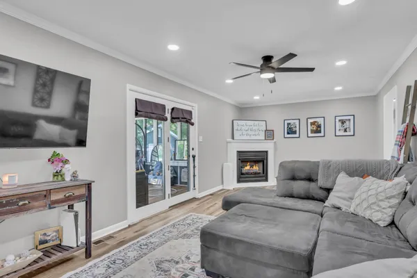 a living room with furniture and a fireplace