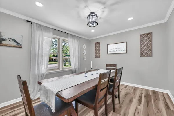 a view of a dining room with furniture window and outside view