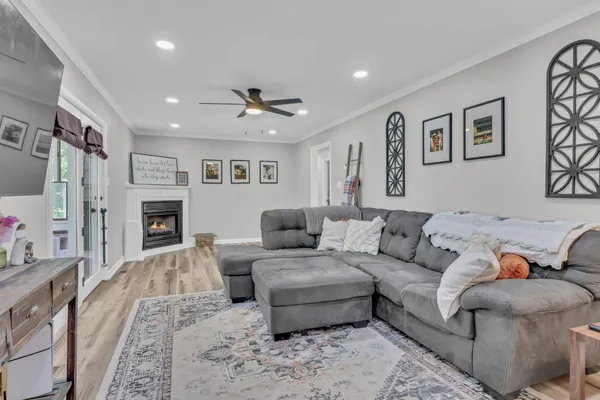a living room with furniture and a fireplace