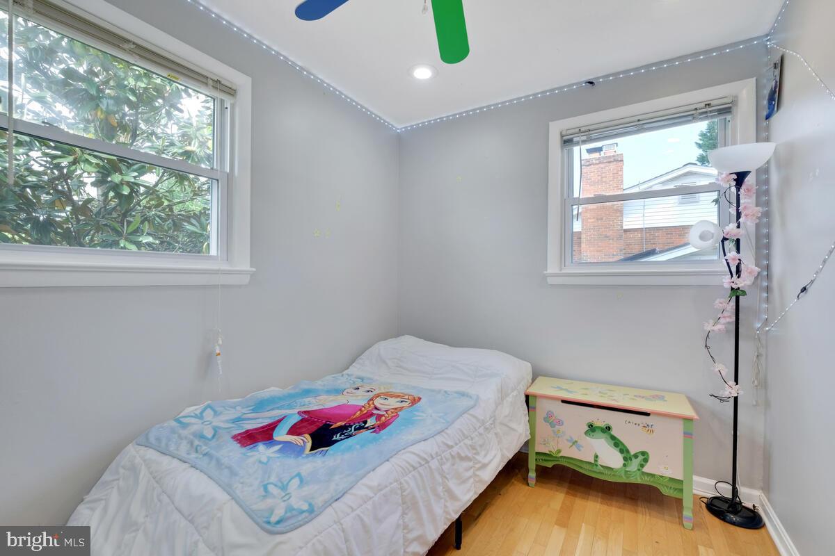 12900 Glynis Road Clinton, MD 20735 - Photo 15 of 38 a bedroom with a bed and a window