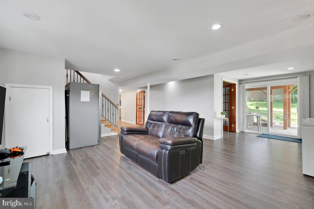 12900 Glynis Road Clinton, MD 20735 - Photo 17 of 38 a living room with furniture and a wooden floor