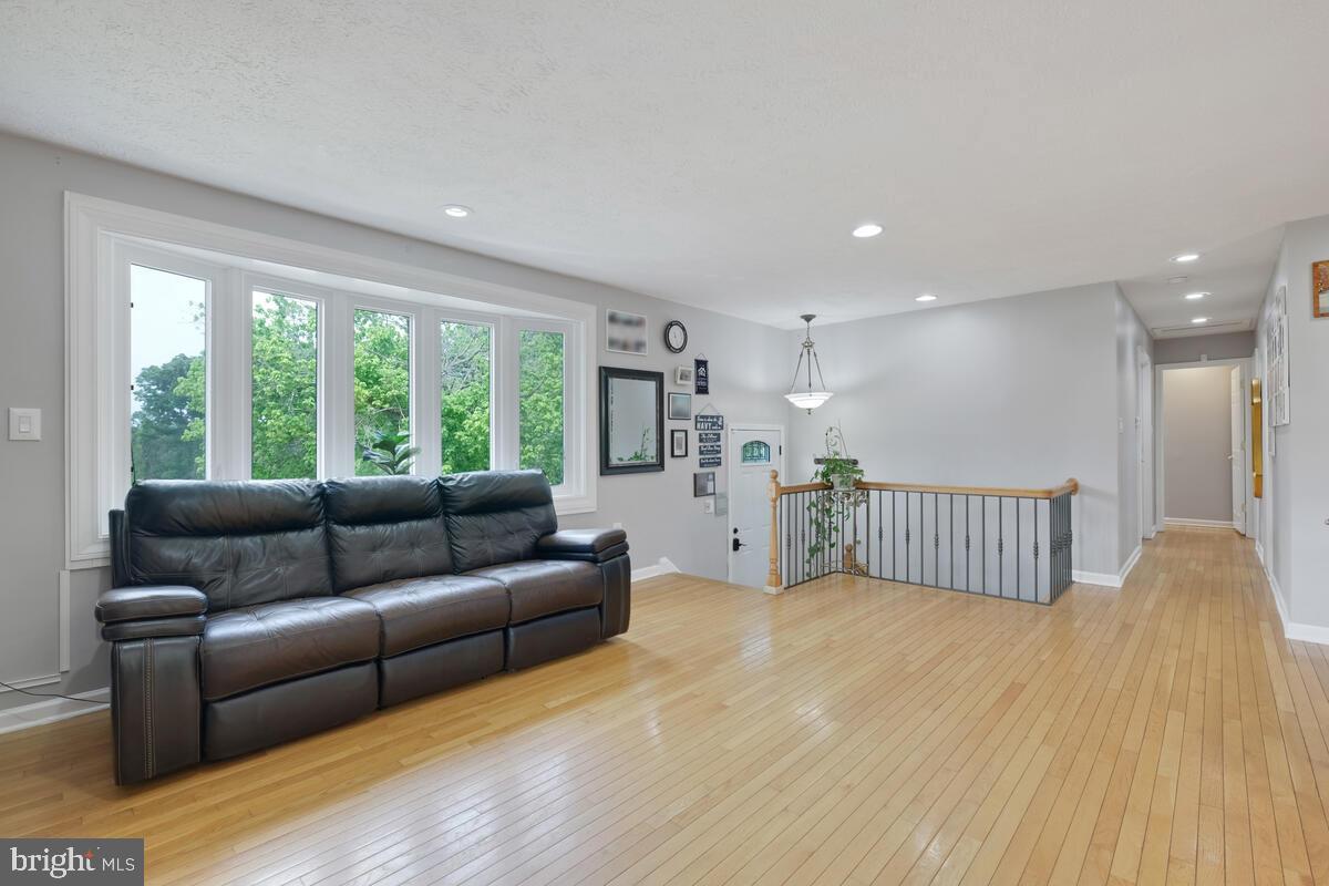12900 Glynis Road Clinton, MD 20735 - Photo 2 of 38 a living room with furniture and a large window