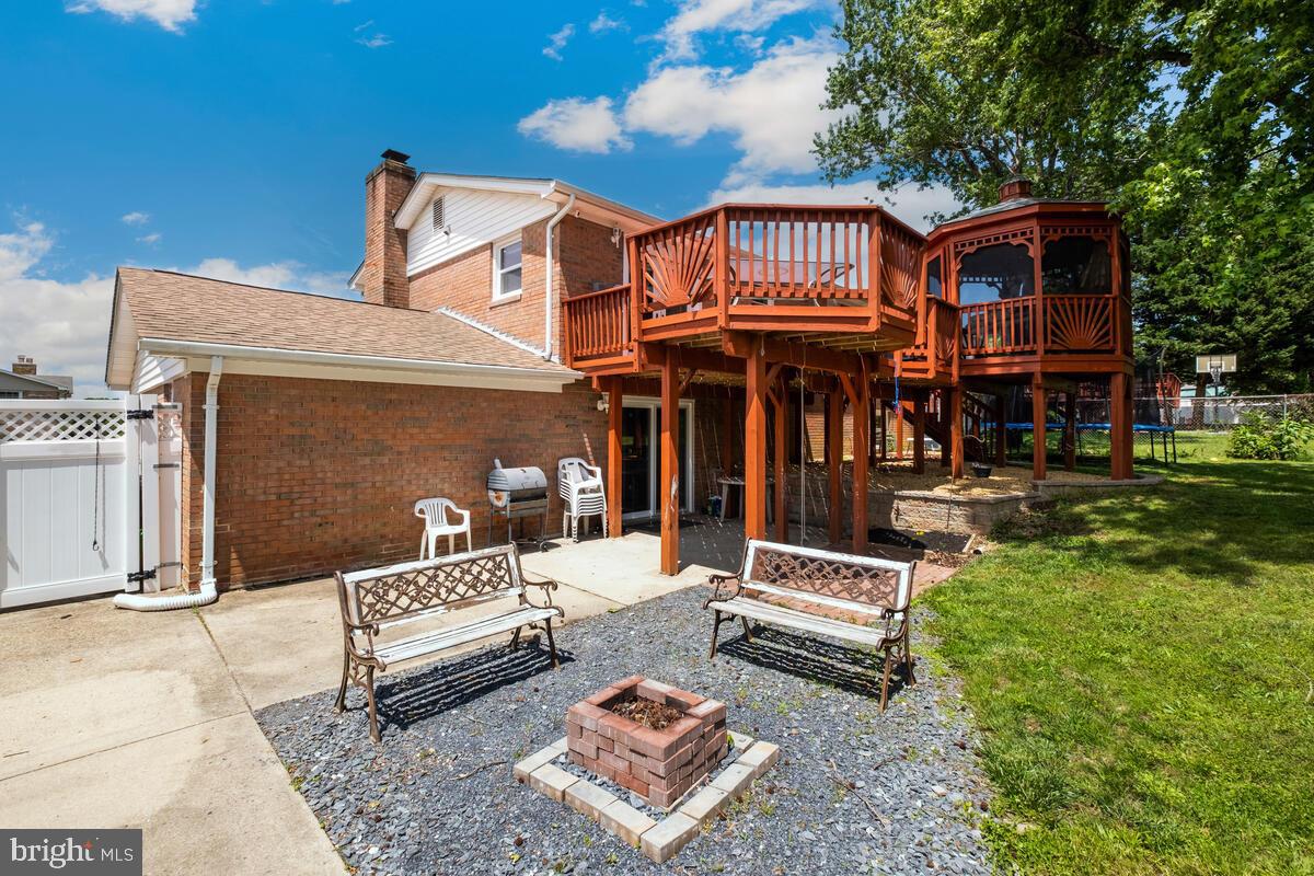 12900 Glynis Road Clinton, MD 20735 - Photo 27 of 38 a view of a building with a yard balcony and furniture