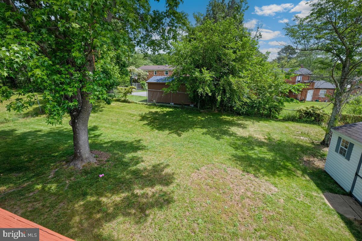 12900 Glynis Road Clinton, MD 20735 - Photo 30 of 38 a view of a backyard with a garden