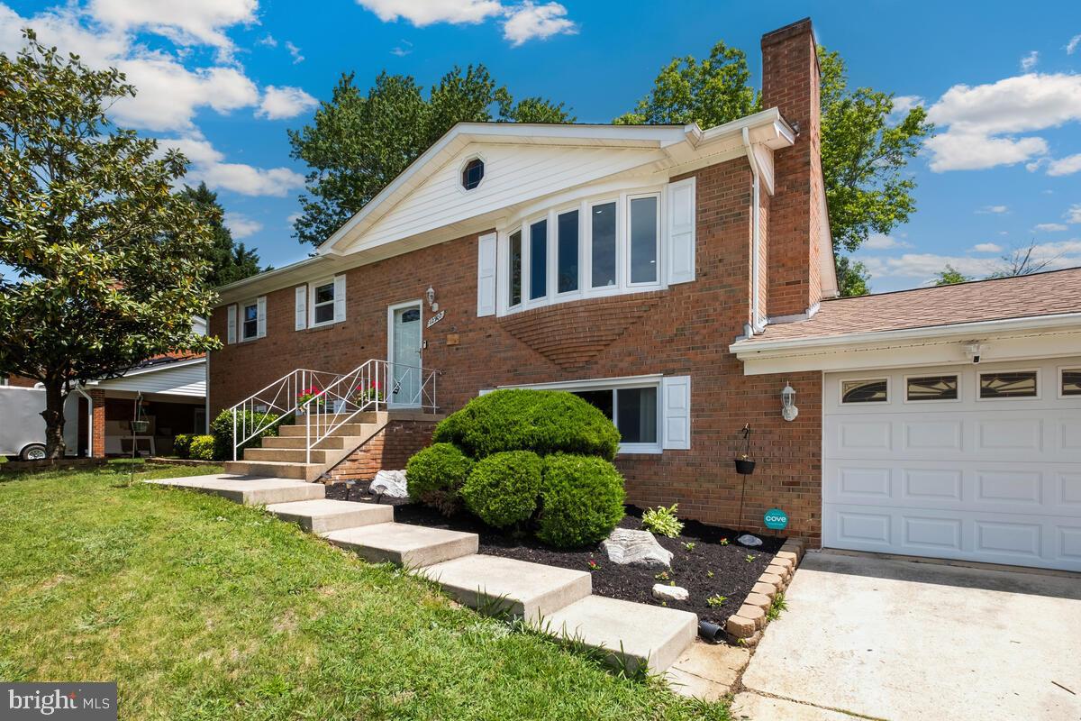 12900 Glynis Road Clinton, MD 20735 - Photo 33 of 38 front view of a house with a yard
