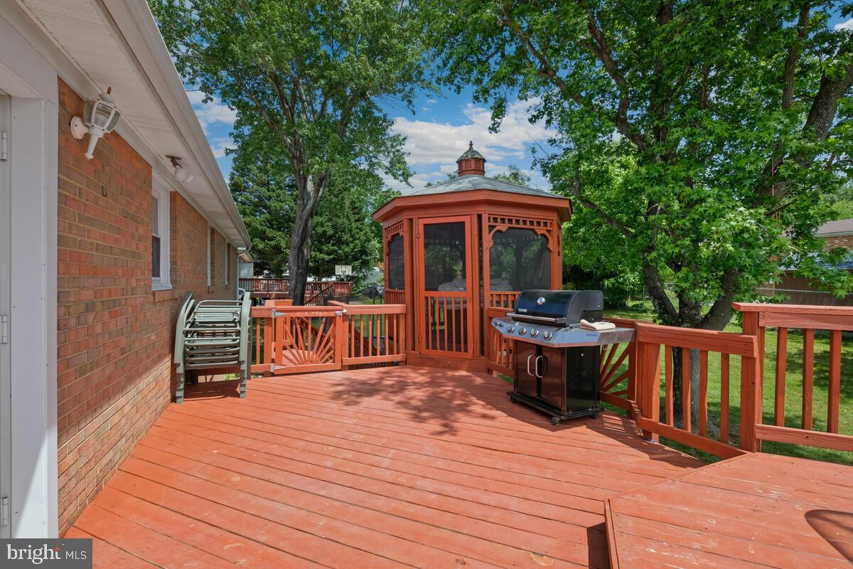 12900 Glynis Road Clinton, MD 20735 - Photo 34 of 38 a table and chairs in front of a house