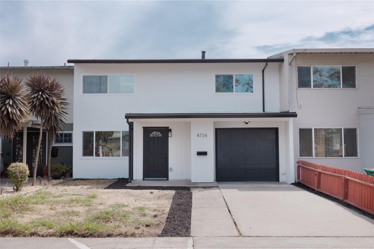 4734 Cutting Boulevard Richmond, CA 94804 - Photo 1 of 1 a front view of a house with a garage