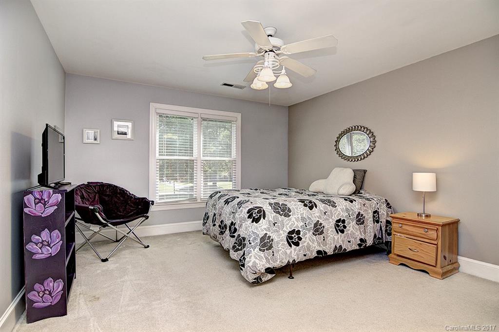 443 Beacon Knoll Lane Fort Mill, SC 29708 - Photo 19 of 24 a bedroom with a bed and a window