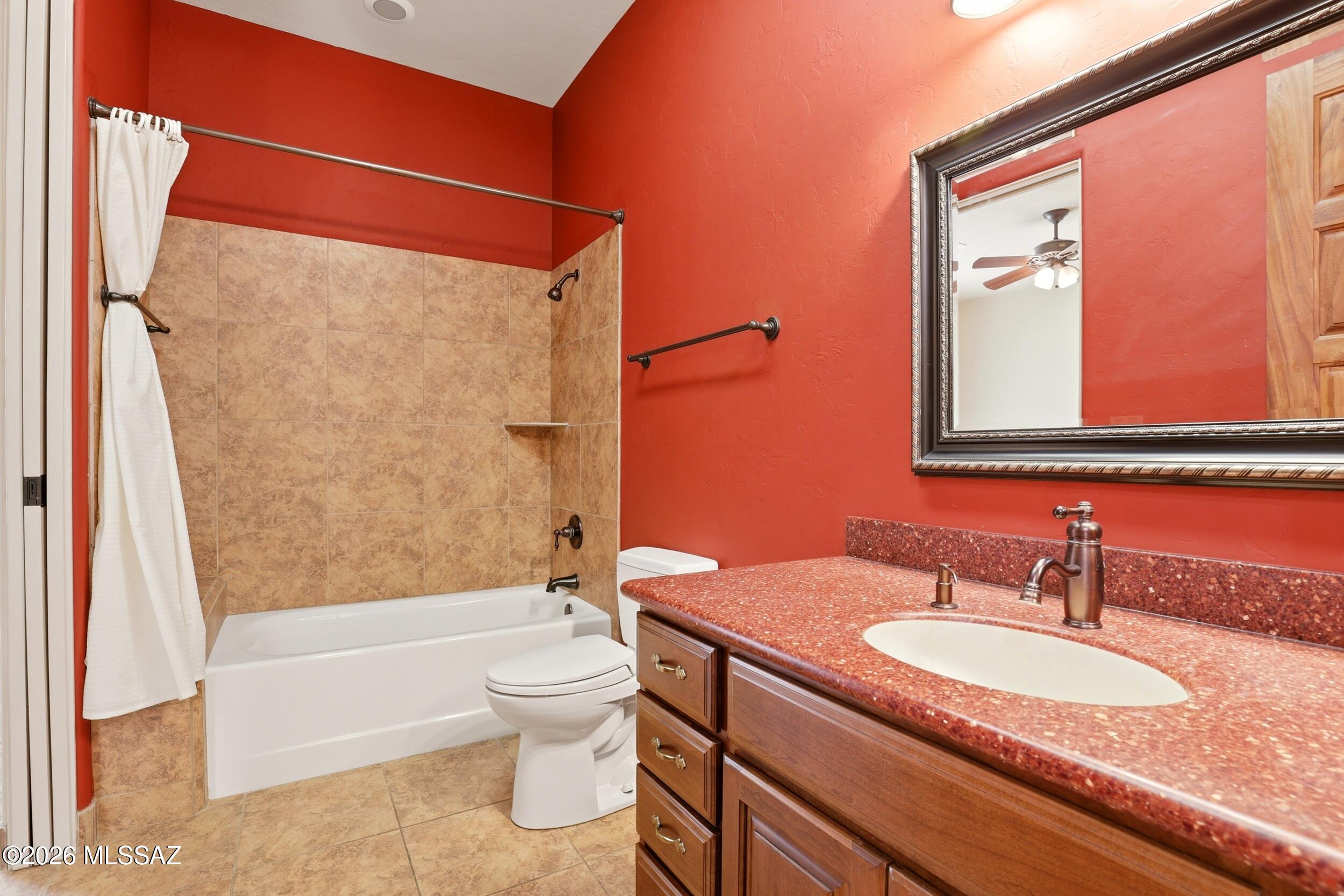6331 West Trails End Road Tucson, AZ 85745 - Photo 20 of 41 a bathroom with a granite countertop sink toilet and shower