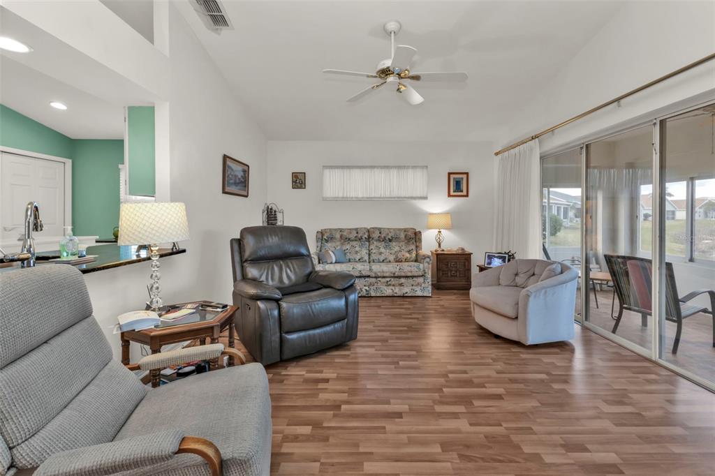 24117 Buckingham Way Punta Gorda, FL 33980 - Photo 8 of 41 a living room with furniture and a wooden floor