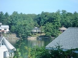 9 A Worcester Avenue, Unit 9A Hudson, MA 01749 - Photo 1 of 10 a view of a lake from a balcony
