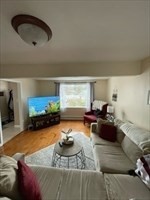 9 A Worcester Avenue, Unit 9A Hudson, MA 01749 - Photo 3 of 10 a living room with furniture and a fireplace