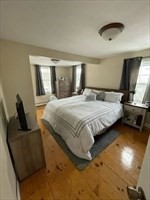 9 A Worcester Avenue, Unit 9A Hudson, MA 01749 - Photo 6 of 10 a bedroom with a bed and window