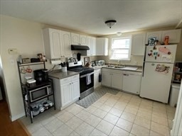 9 A Worcester Avenue, Unit 9A Hudson, MA 01749 - Photo 8 of 10 a kitchen with a sink appliances and cabinets