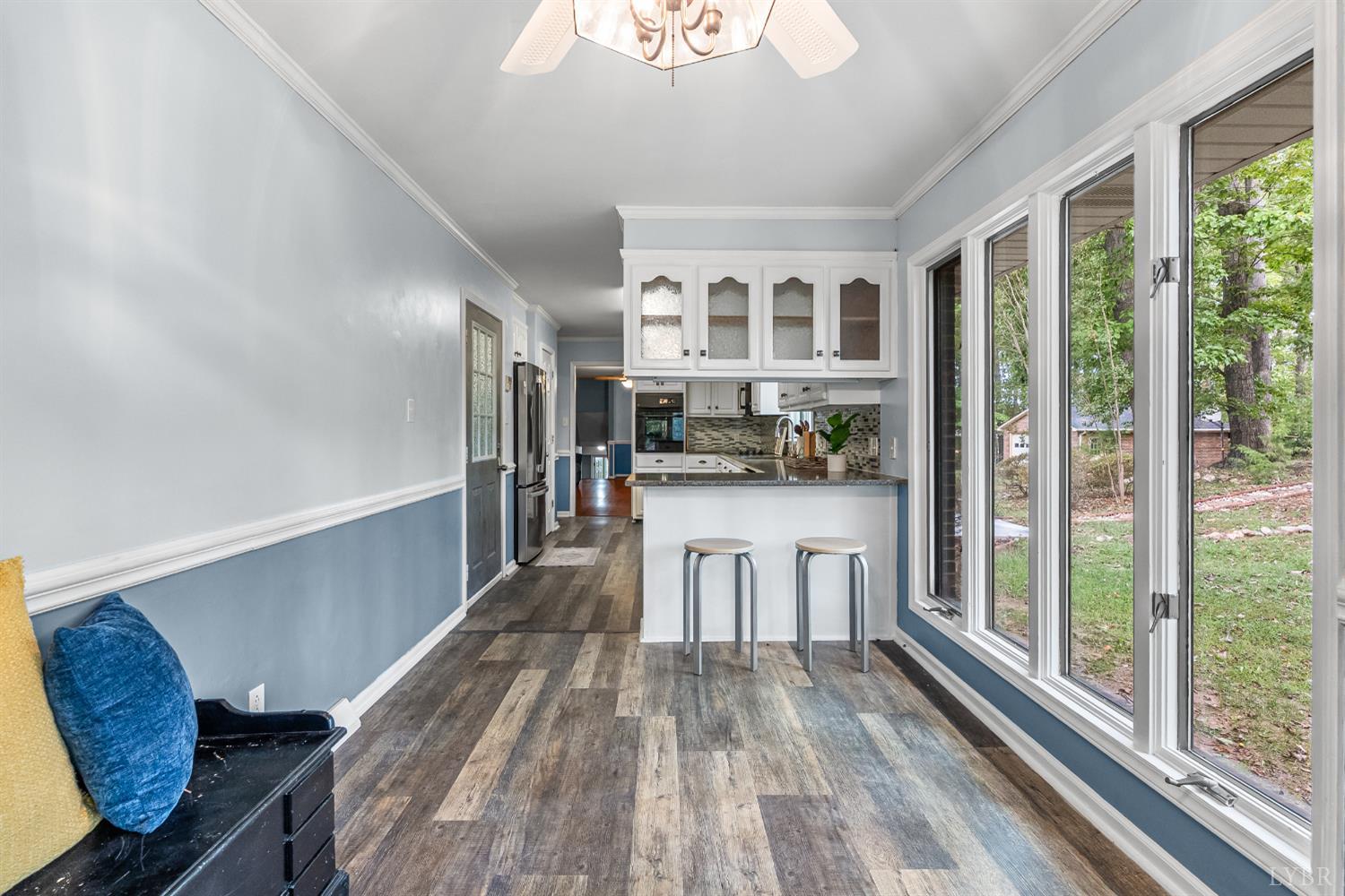 1773 Barker Road Ringgold, VA 24586 - Photo 12 of 40 a view of a kitchen with kitchen island wooden floor and stainless steel appliances