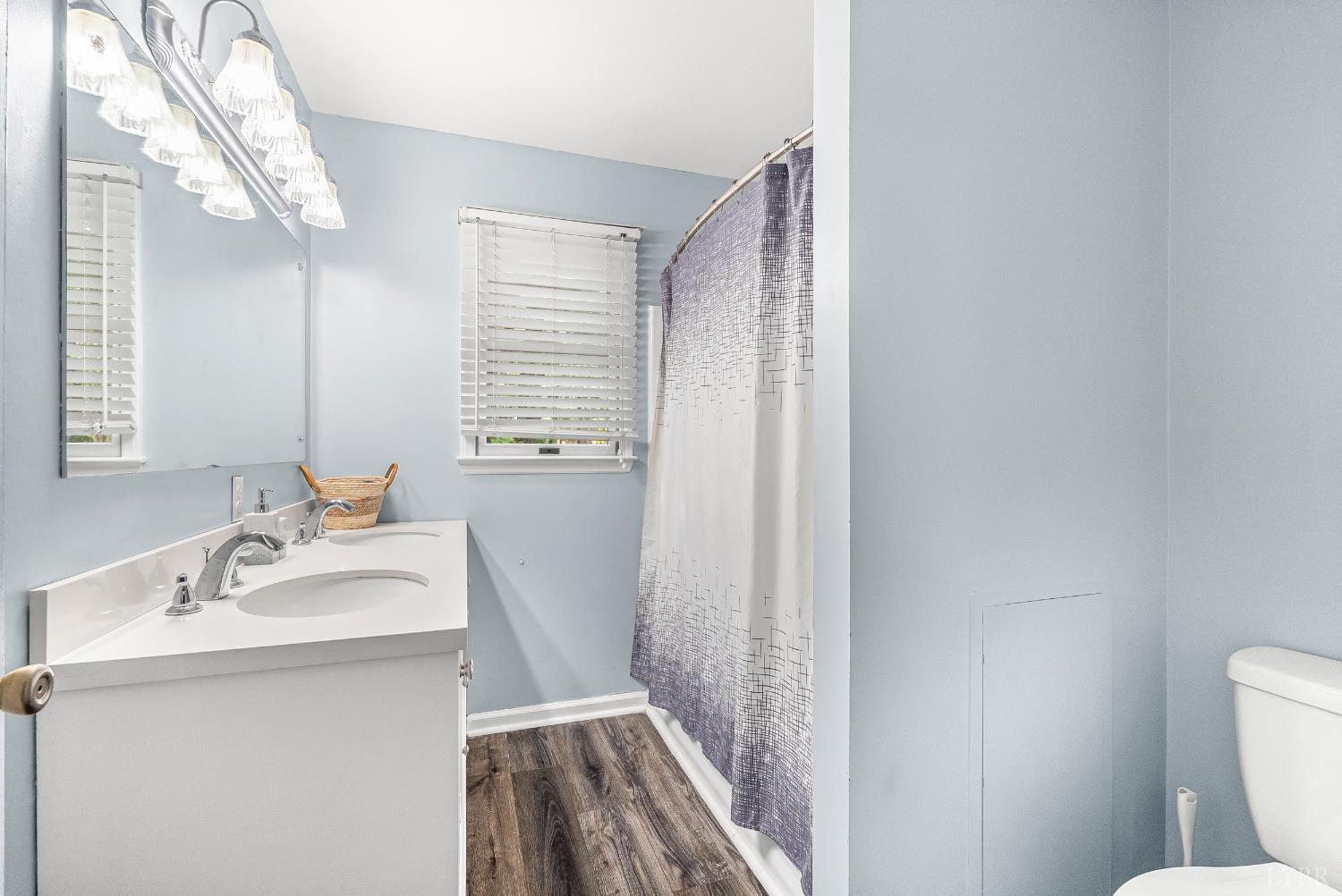1773 Barker Road Ringgold, VA 24586 - Photo 15 of 40 a bathroom with a sink a toilet and a mirror