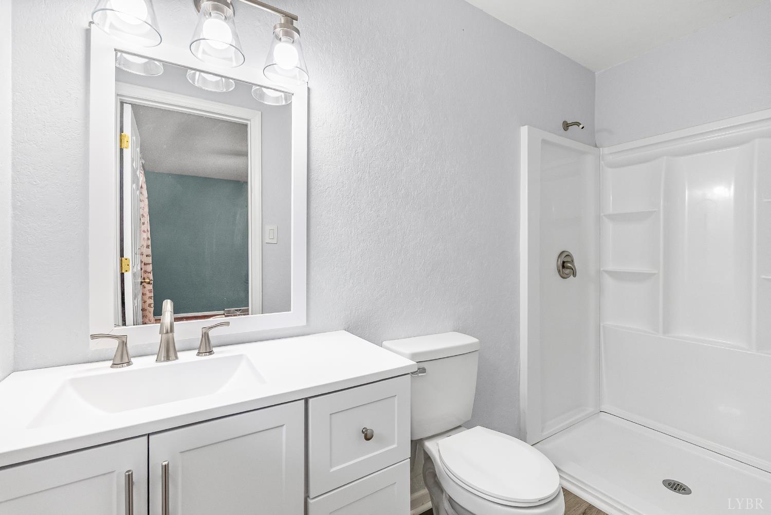 1773 Barker Road Ringgold, VA 24586 - Photo 17 of 40 a bathroom with a sink a toilet and shower