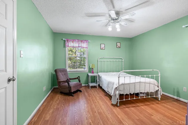 a bedroom with a bed and a chair