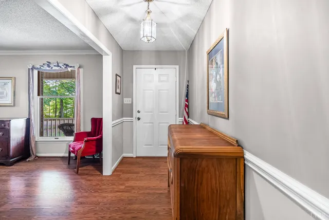 a room with furniture and wooden floor