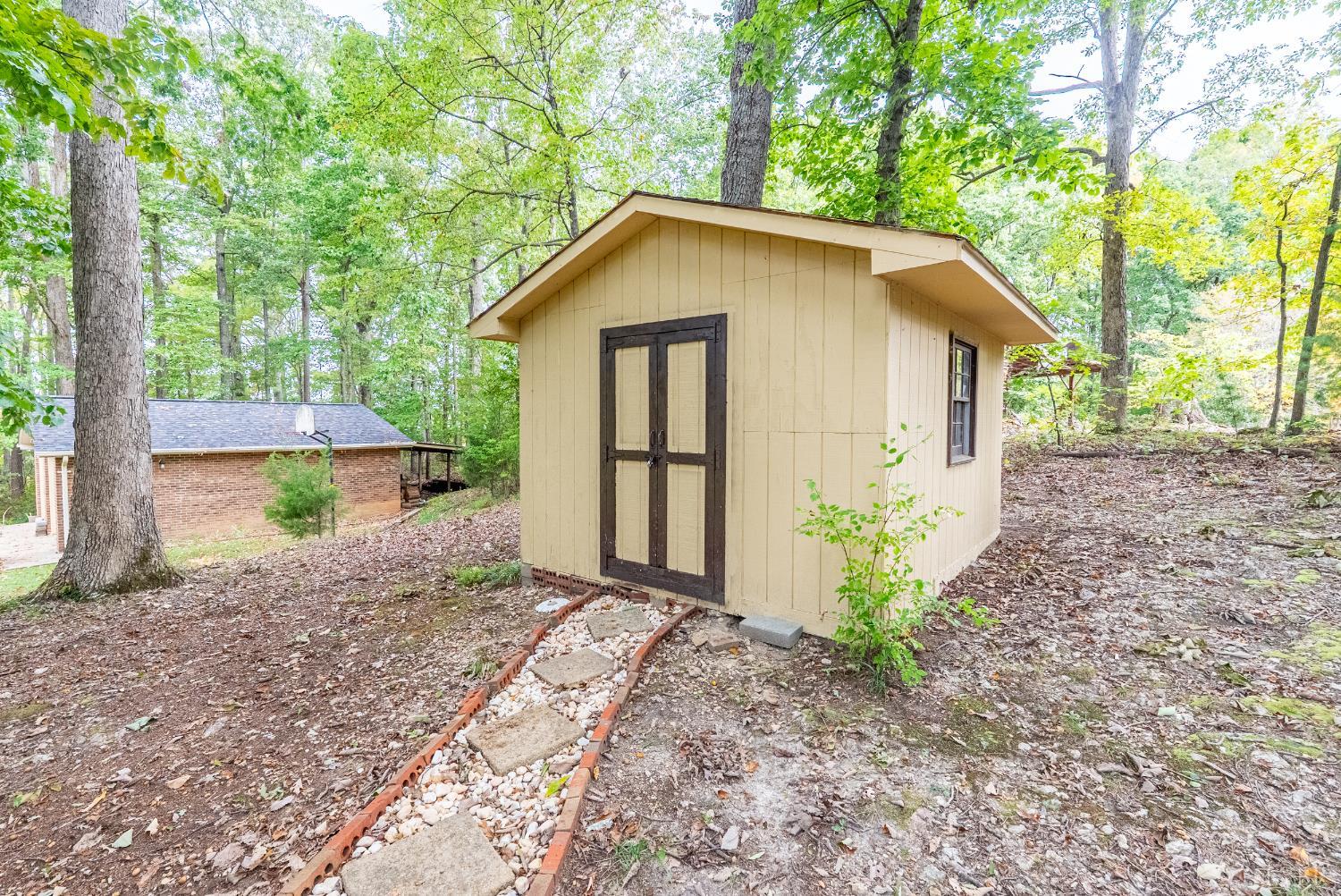 1773 Barker Road Ringgold, VA 24586 - Photo 32 of 40 a view of a house with a yard and large tree