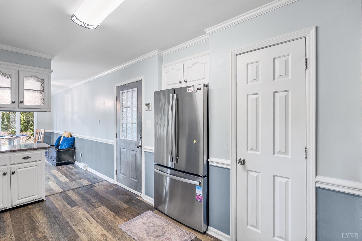 1773 Barker Road Ringgold, VA 24586 - Photo 8 of 40 a kitchen with stainless steel appliances a refrigerator and wooden cabinets