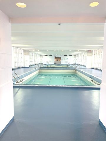 a kitchen with a sink and a stove top oven